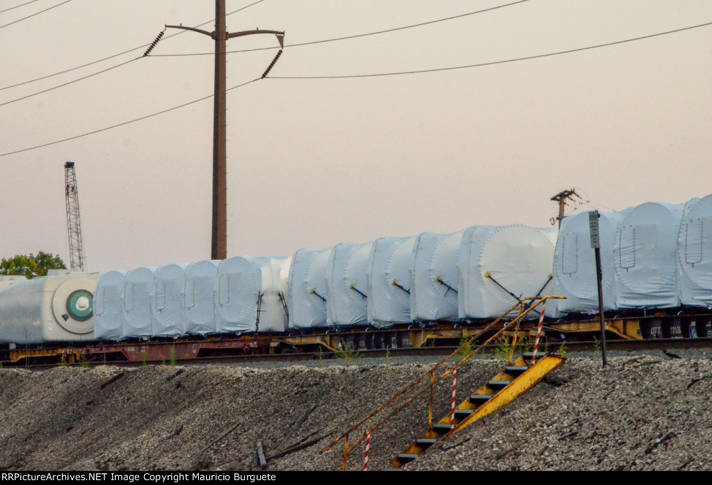 QTTX & KRL Flat cars with load in the yard